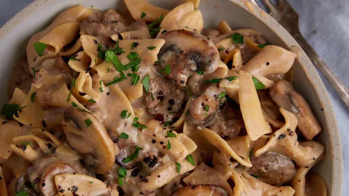 A serving dish of creamy beef stroganoff.
