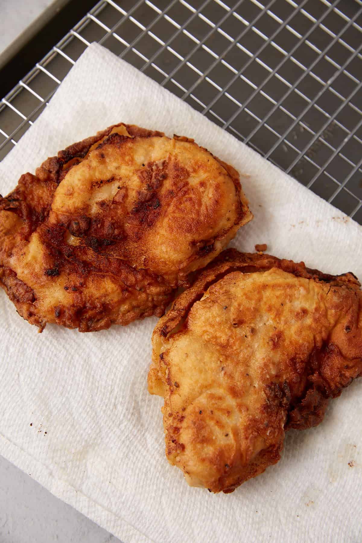 fried chicken sitting on paper towels