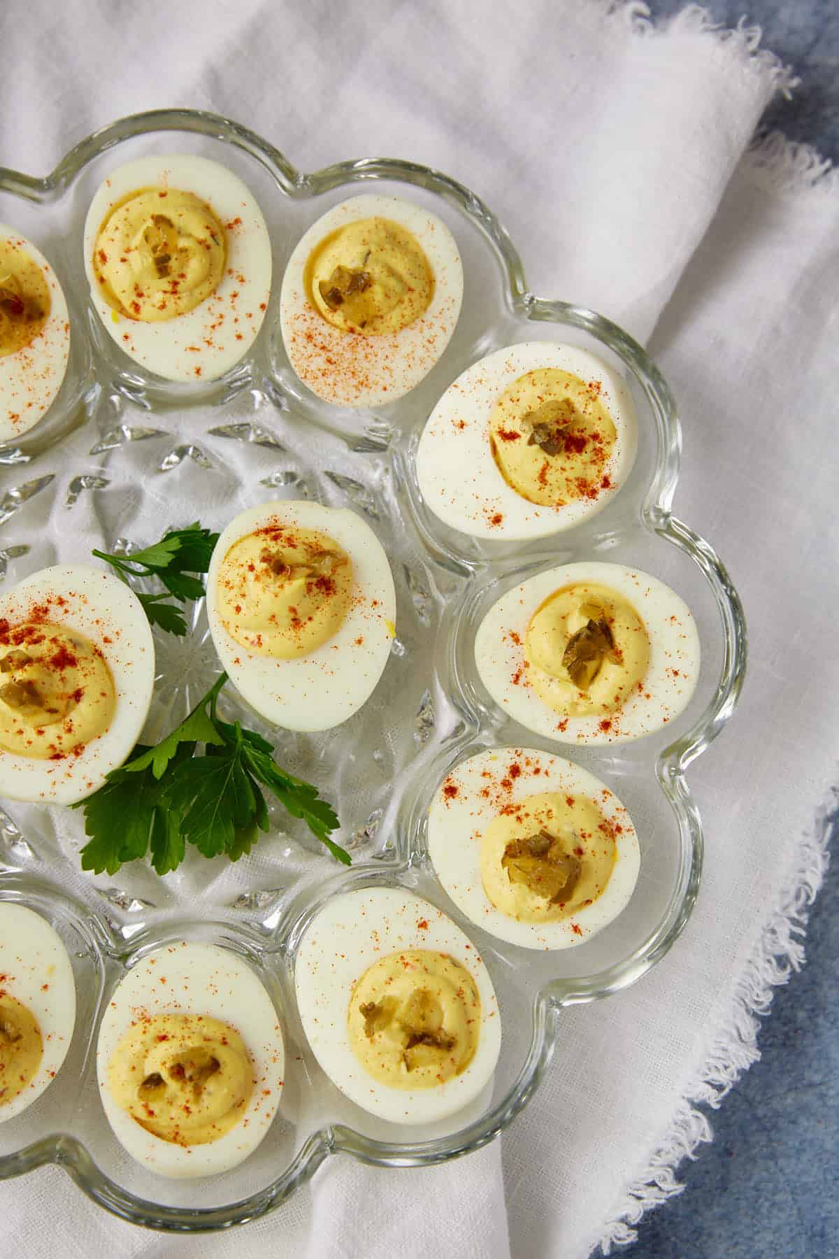Deviled eggs with pickle relish on a platter.