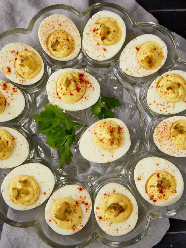 An egg platter filled with deviled eggs with relish.