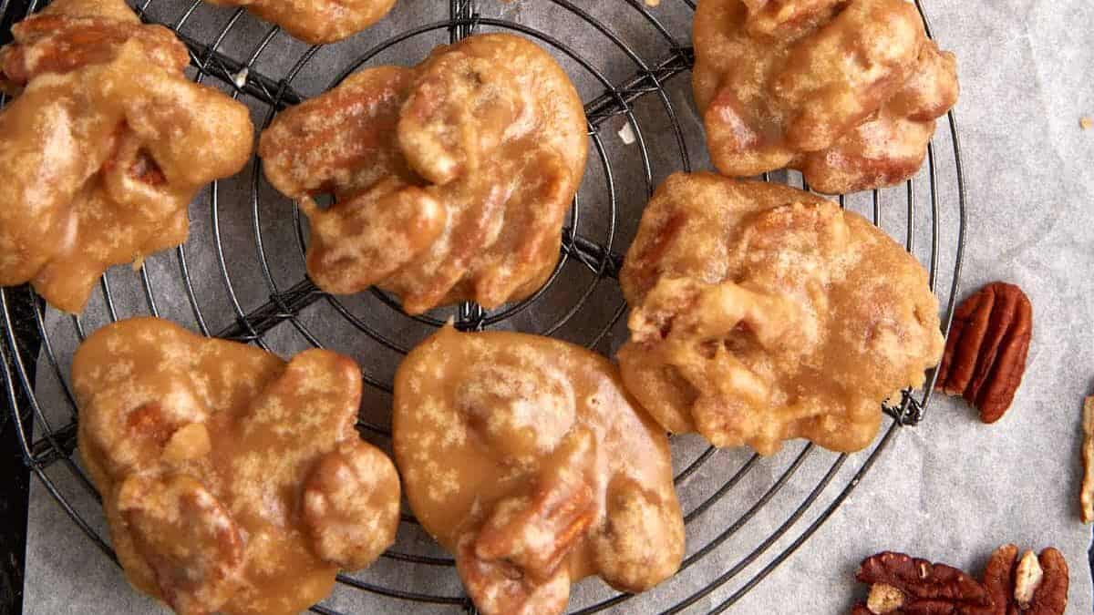 Pecan pralines on a cooling rack.