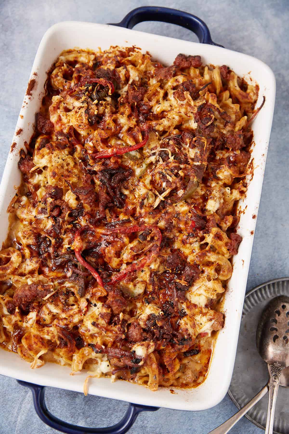 A casserole dish with sausage mac and cheese.