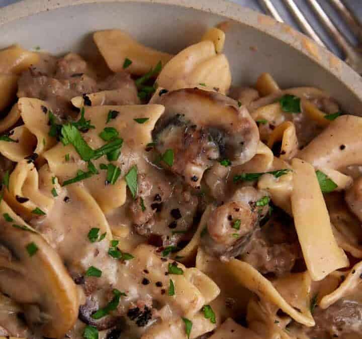 A serving dish of creamy beef stroganoff.