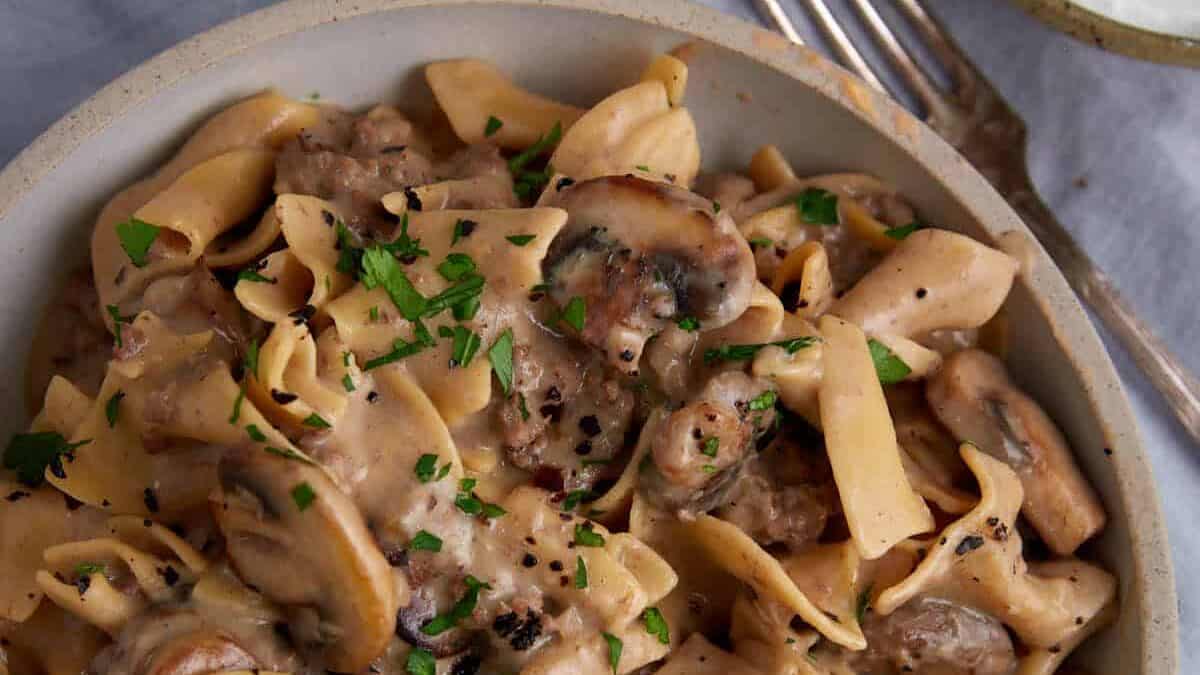 A serving dish of creamy beef stroganoff.