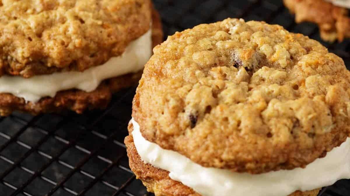 Carrot cake sandwich cookies on a cooling rack