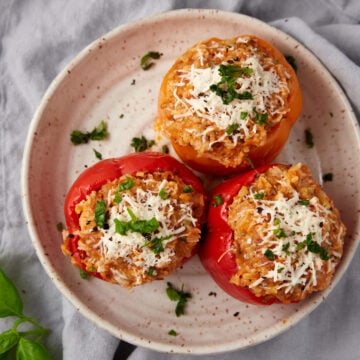 stuffed Italian sausage and peppers on a plate.