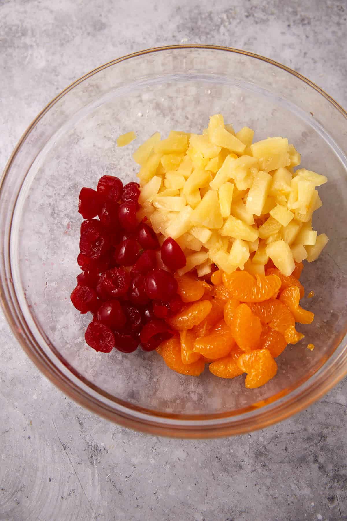 fruit in a glass mixing bowl.