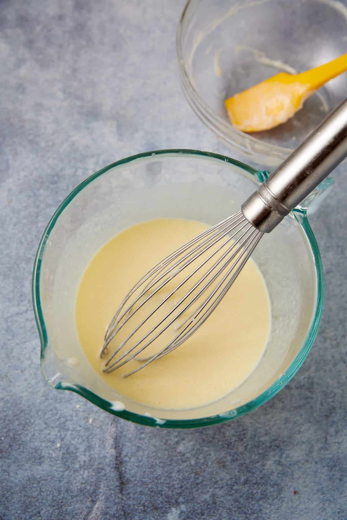 milk, egg, melted butter and cooled paste in a glass measuring cup with a whisk.