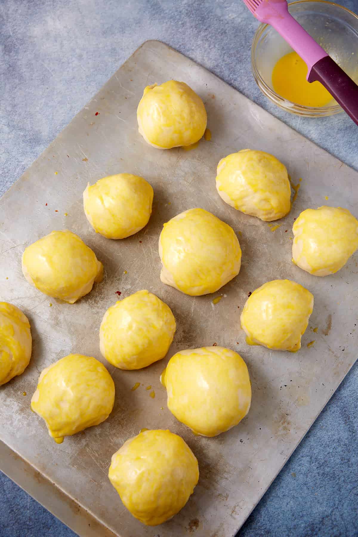 buttermilk yeast rolls unbaked on a baking sheet.