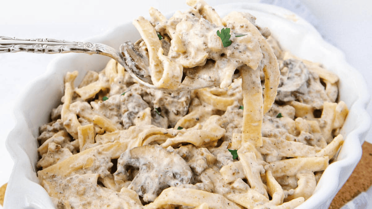Creamy mushroom pasta with a spoon