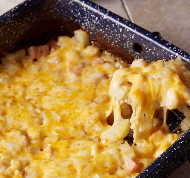 A spoon full of ham casserole.