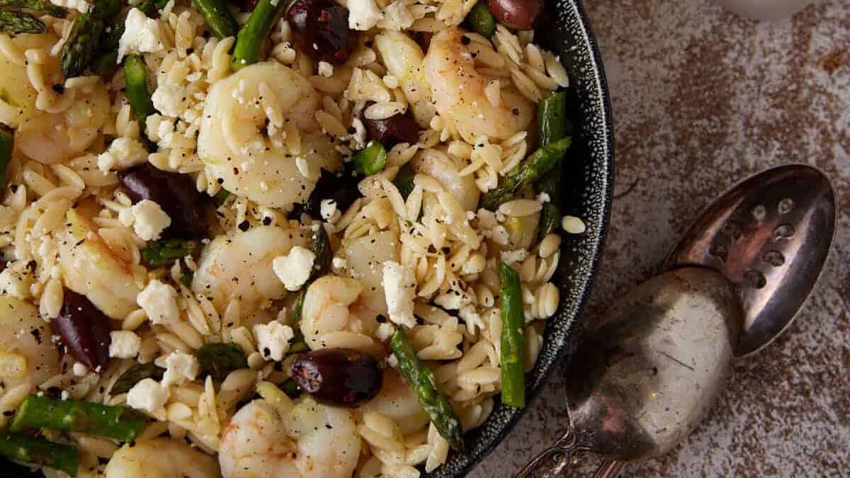 A large bowl of shrimp orzo salad.
