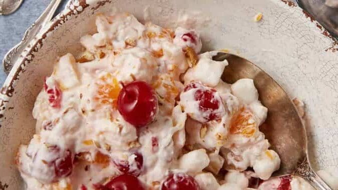 ambrosia salad in a white bowl.