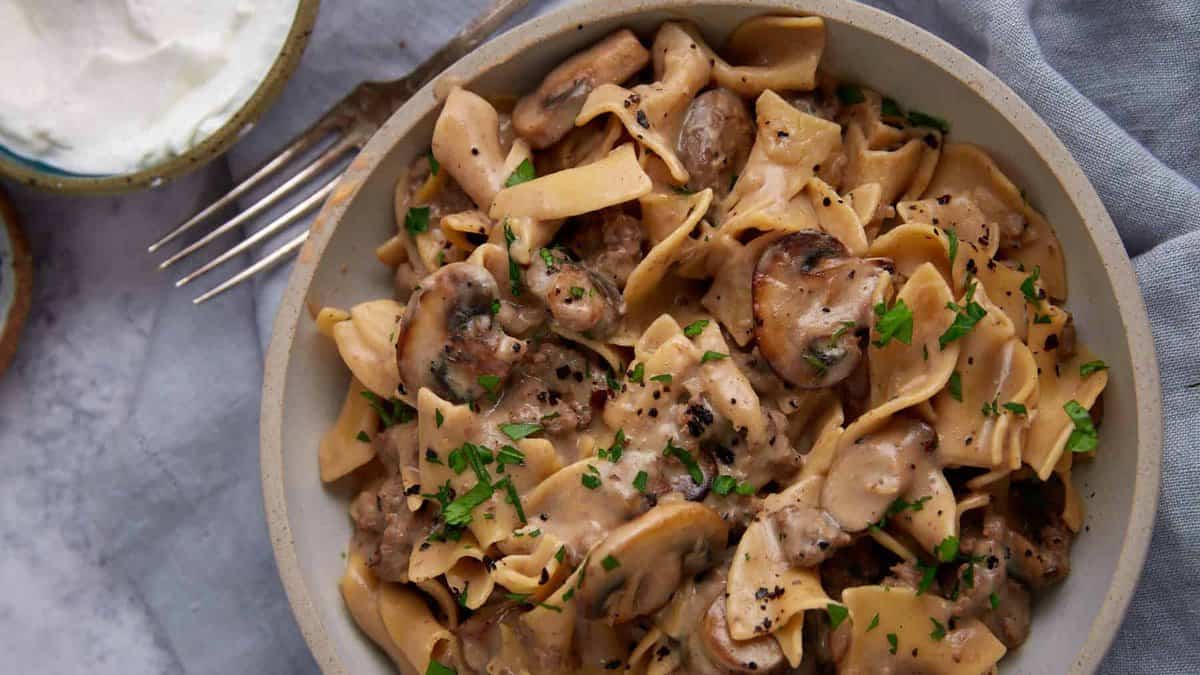 A serving dish of creamy beef stroganoff.