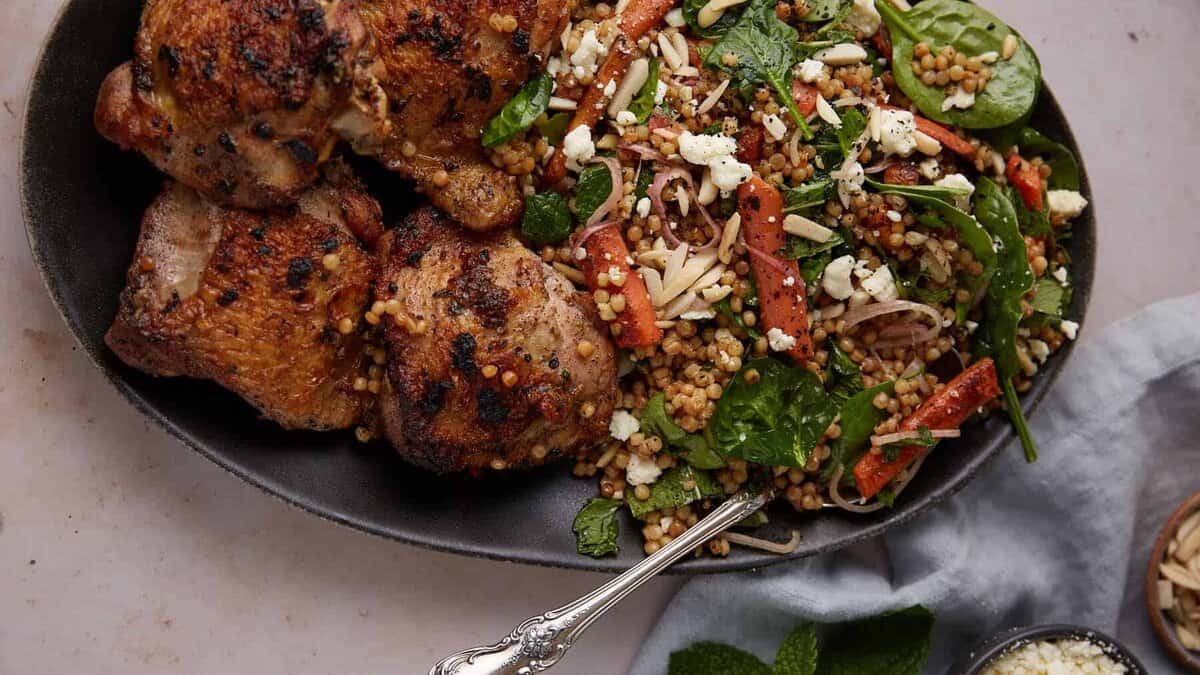 A platter of chicken and couscous.