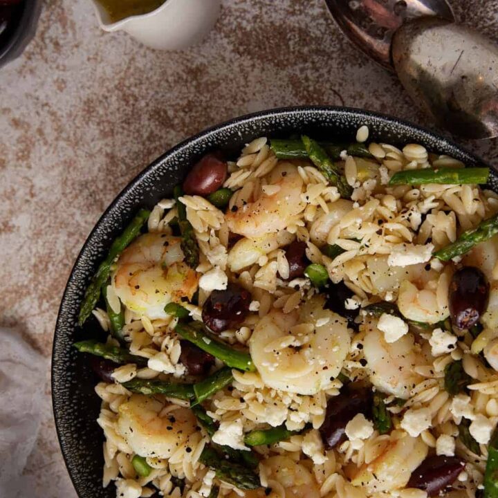 A large bowl of shrimp orzo salad.