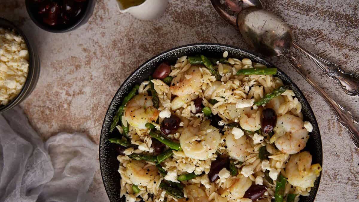 A large bowl of shrimp orzo salad.