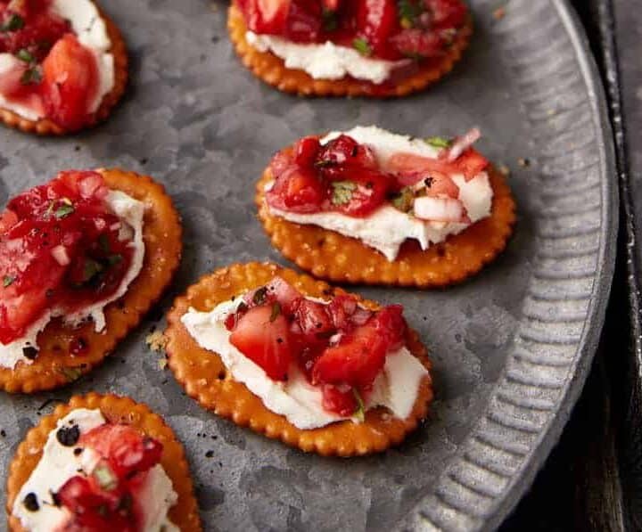 A platter of strawberry finger food appetizers.
