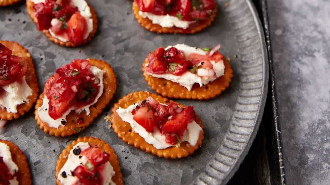 A platter of strawberry finger food appetizers.