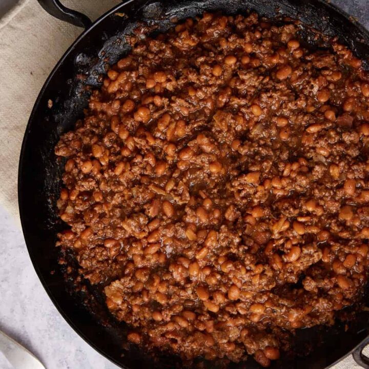 A skillet of cooked baked beans.