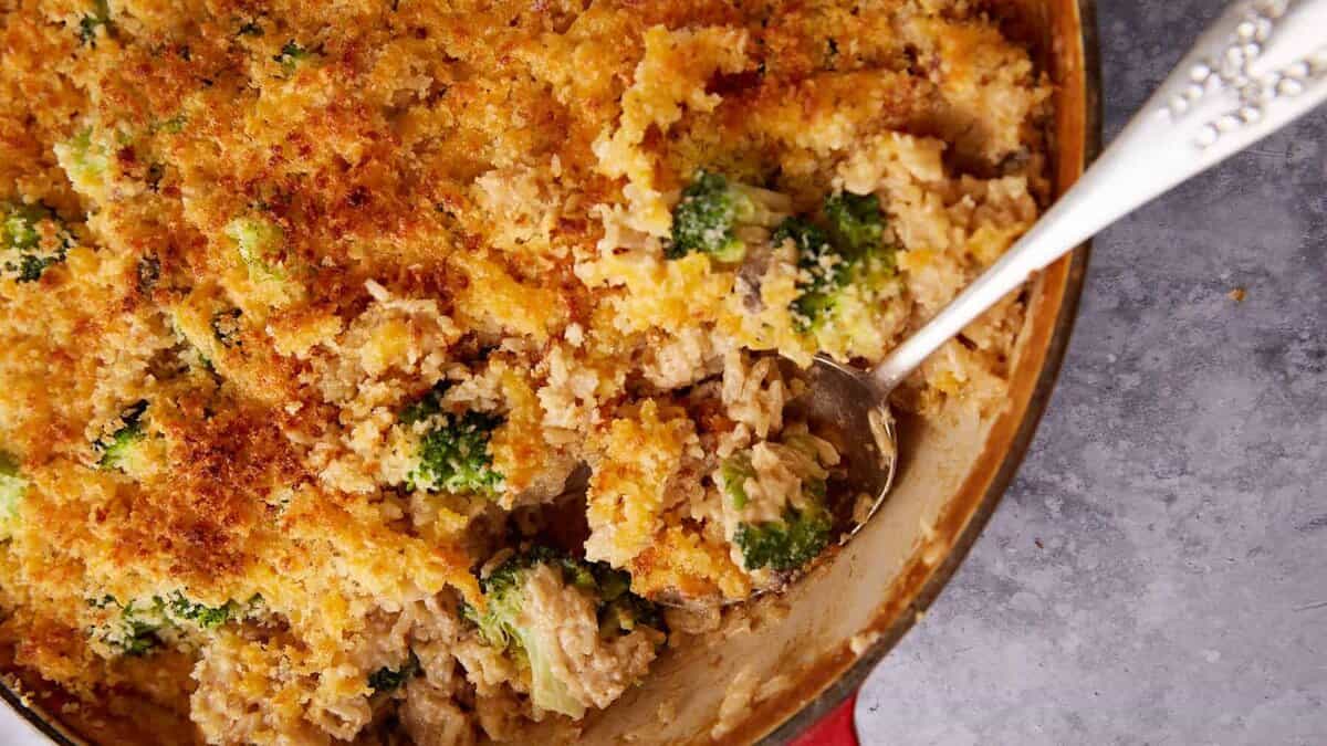 A broccoli rice casserole in a skillet.