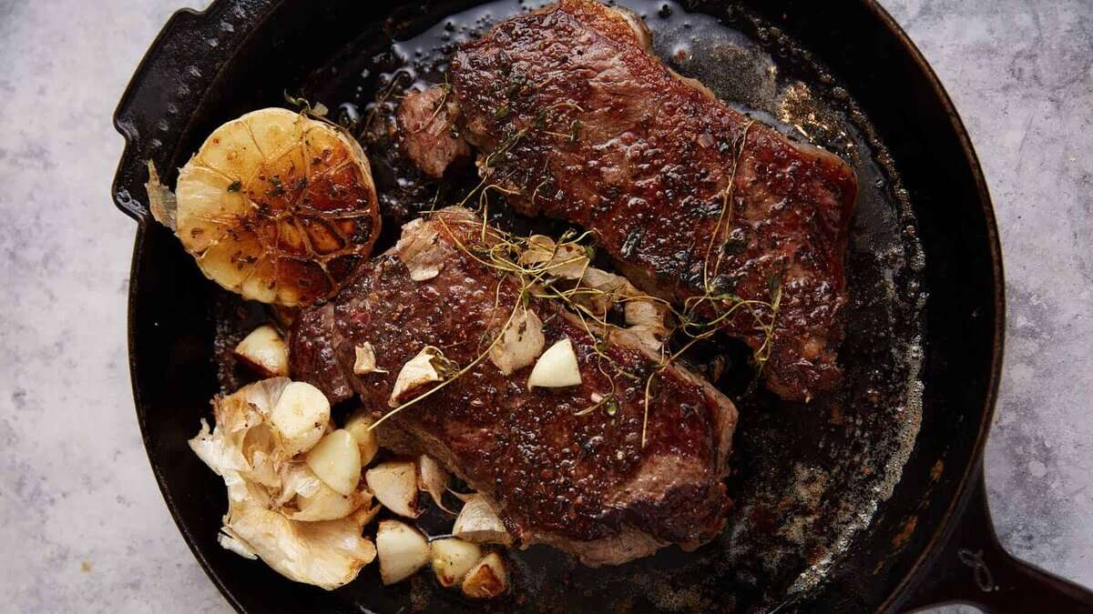 Steaks after they have cooked in the oven.