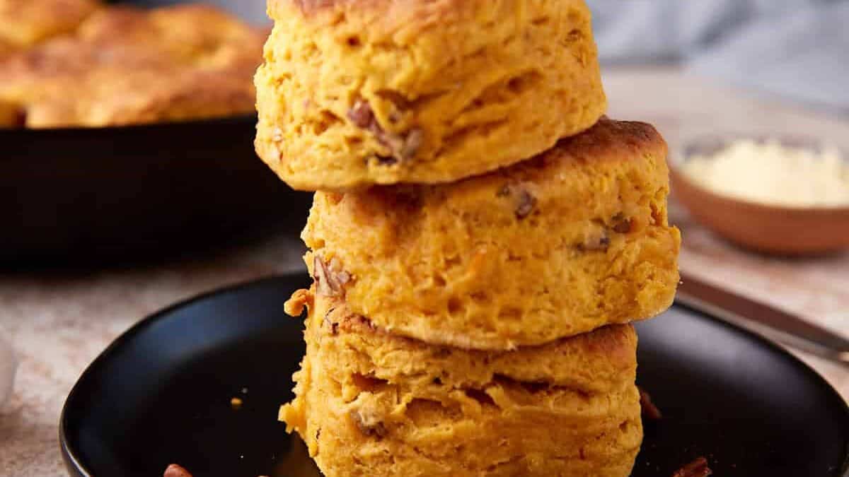 A stack of Sweet potato biscuits on a plate.