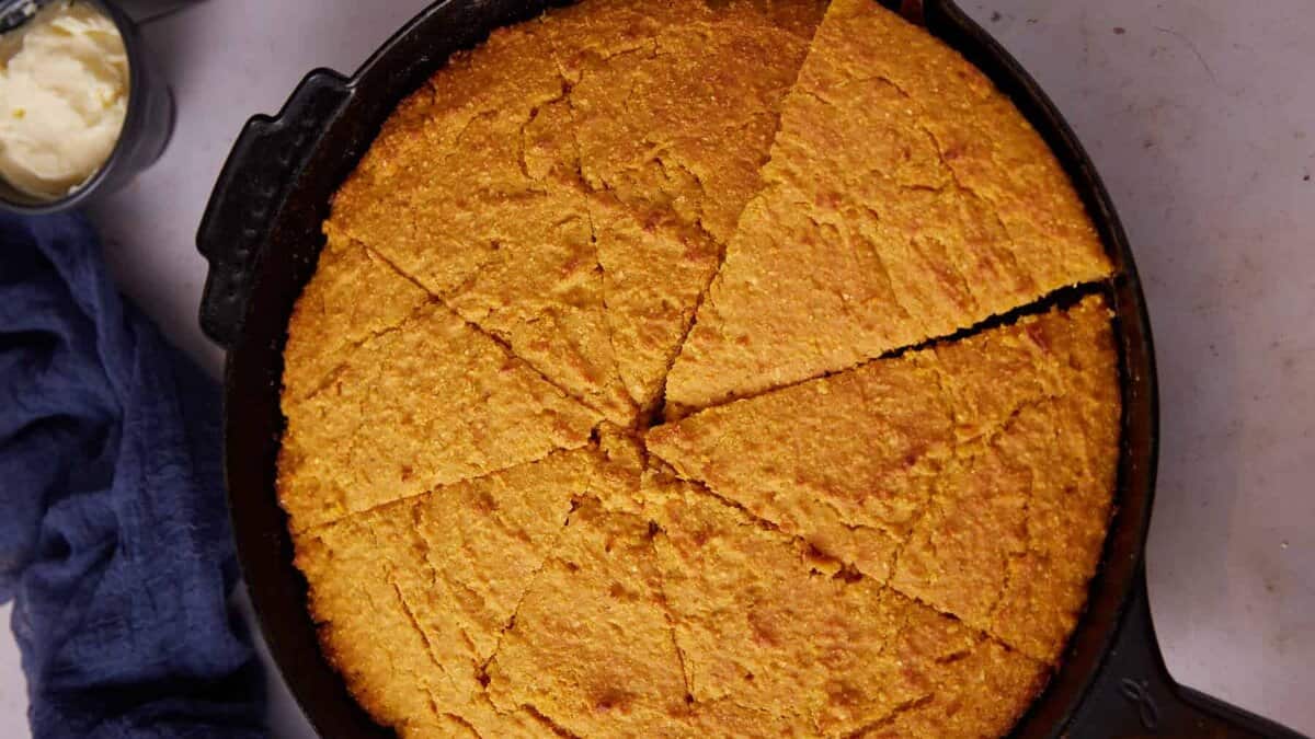 A sweet potato cornbread, cut into wedges.