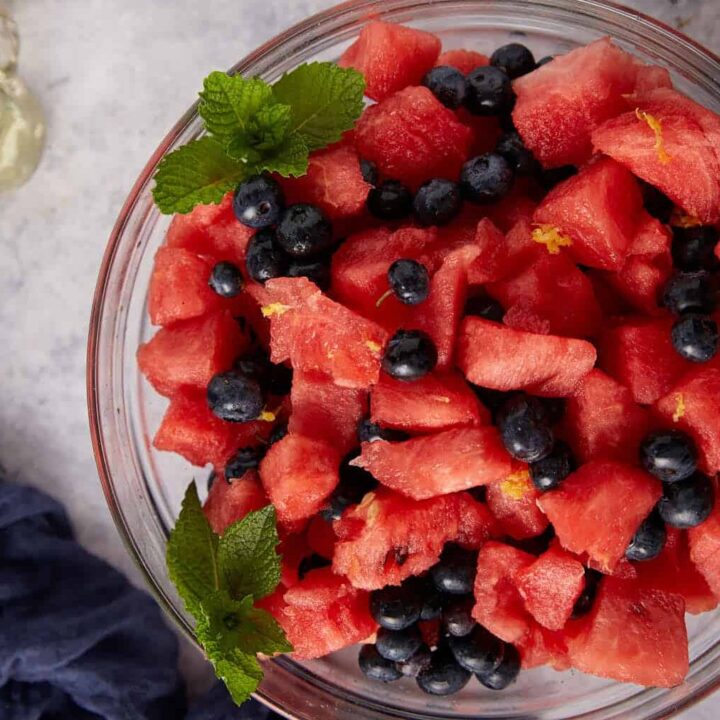 A bowl of watermelon fruit salad with blueberries in a bowl.