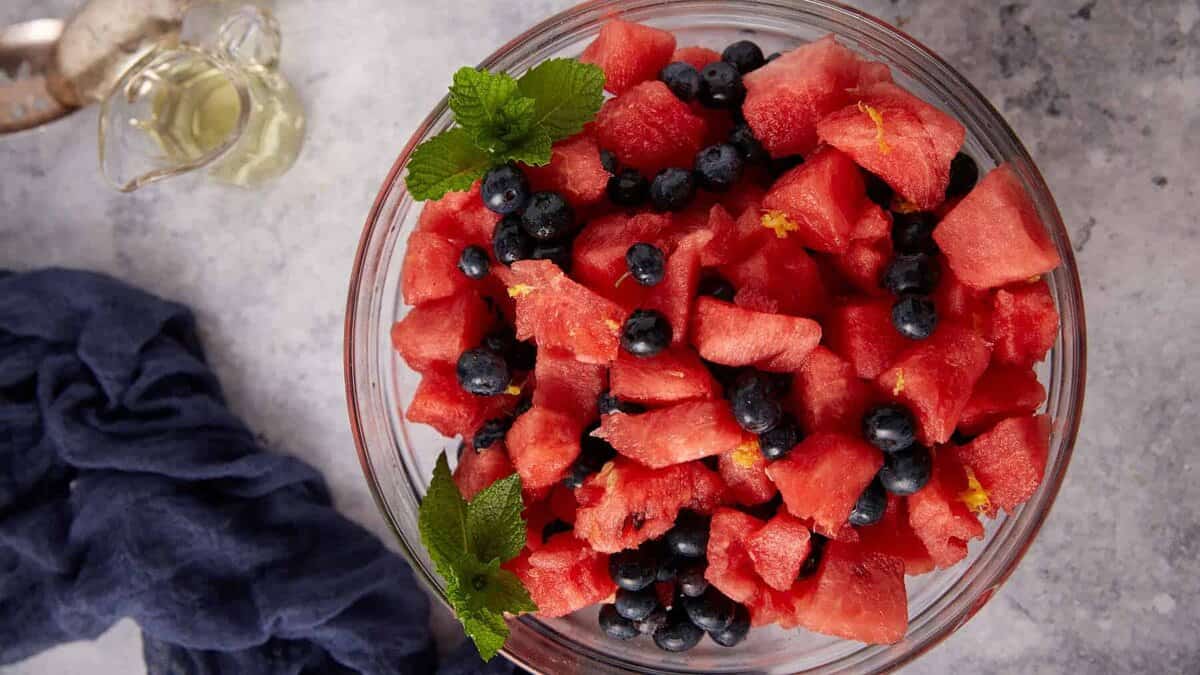 A bowl of watermelon fruit salad with blueberries in a bowl.