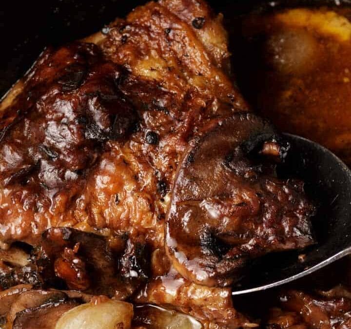 Cooked coq au vin in a slow cooker