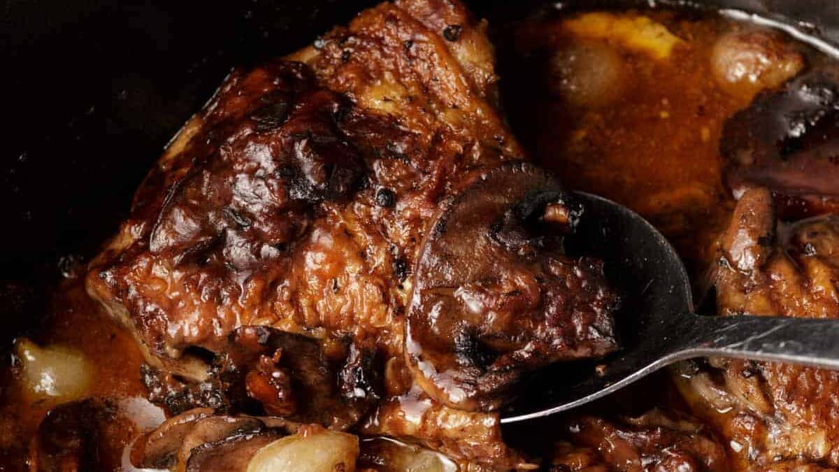 Cooked coq au vin in a slow cooker