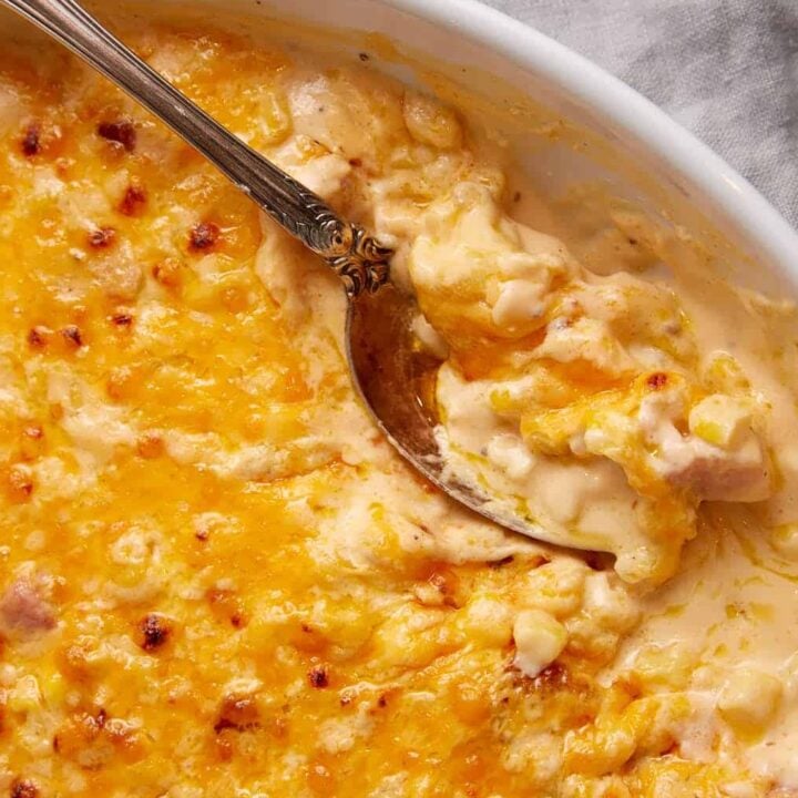 A serving spoon in a corn casserole.