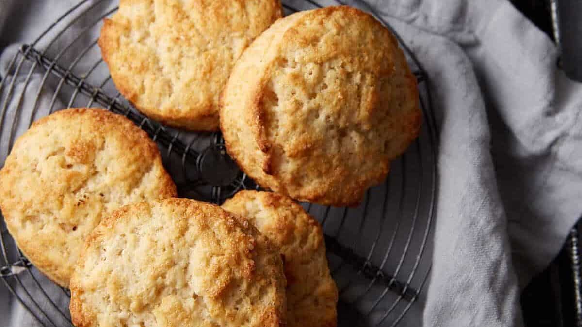 A batch of biscuits on a wire rack.