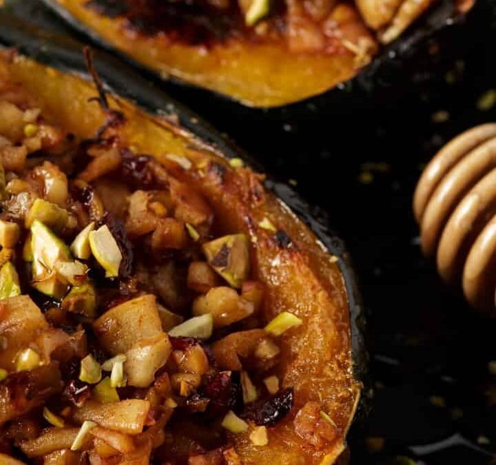 acorn squash on a plate with honey.