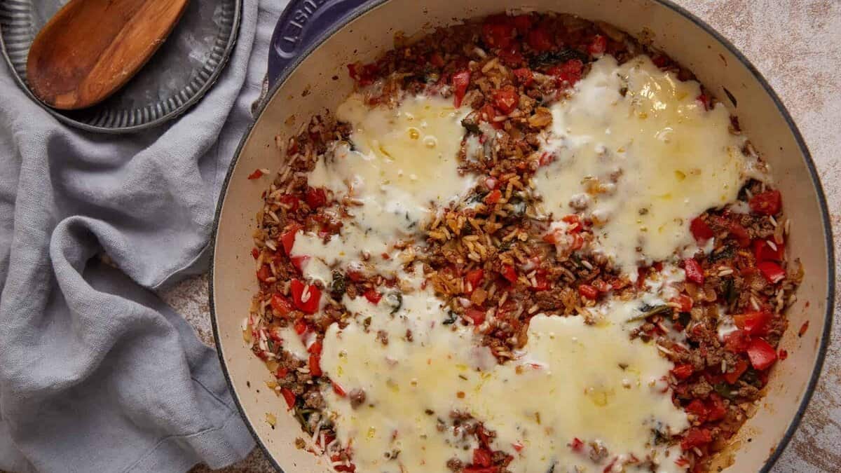 A skillet of cooked hamburger rice casseroel.