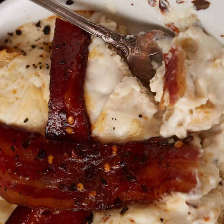 A serving of a hot brown with a fork.