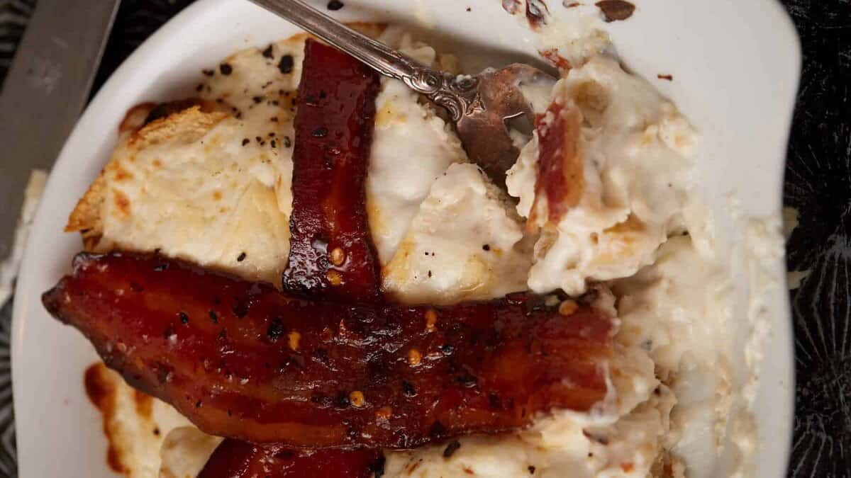 A serving of a hot brown with a fork.