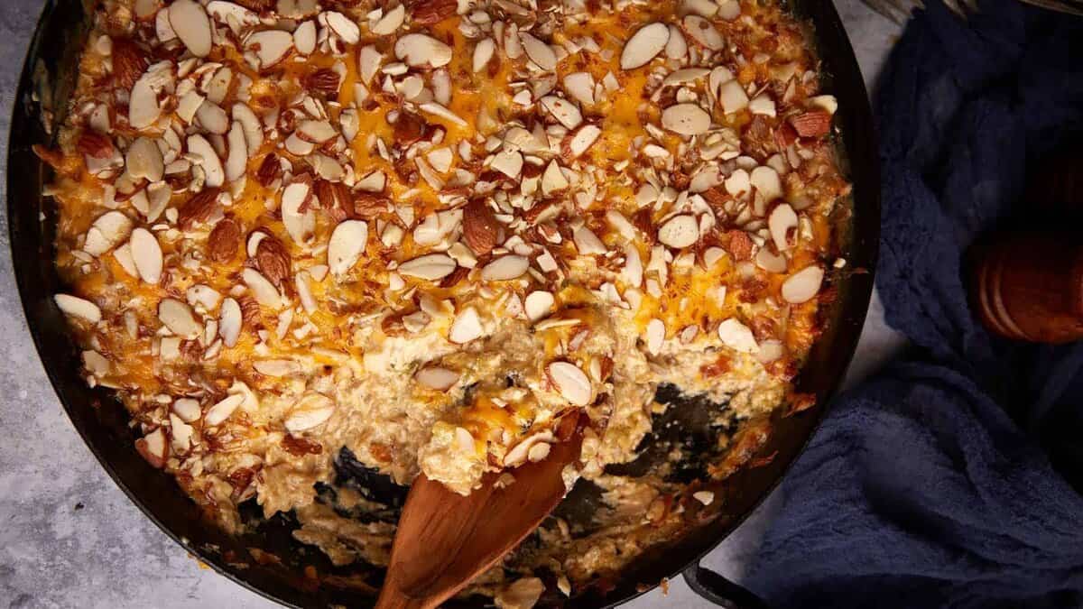 A skillet of baked chicken and wild rice casserole.