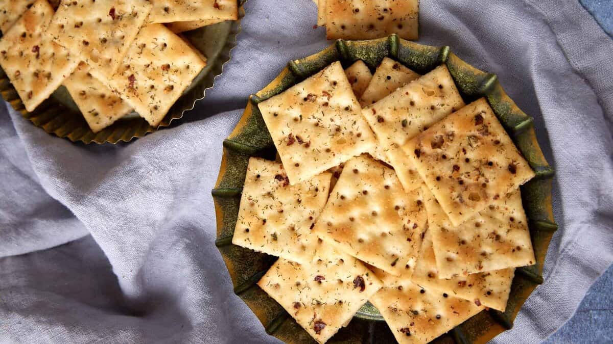 Spicy seasoned crackers on a serving plate.