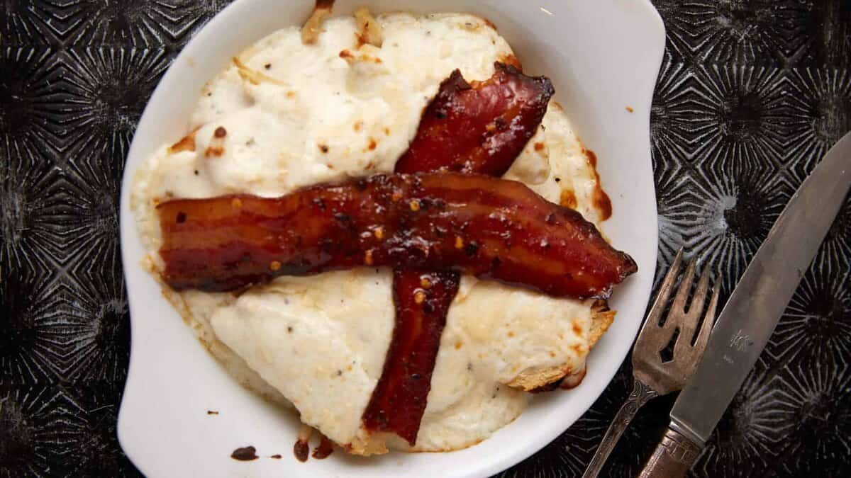 A ramekin with a baked Kentucky hot brown.