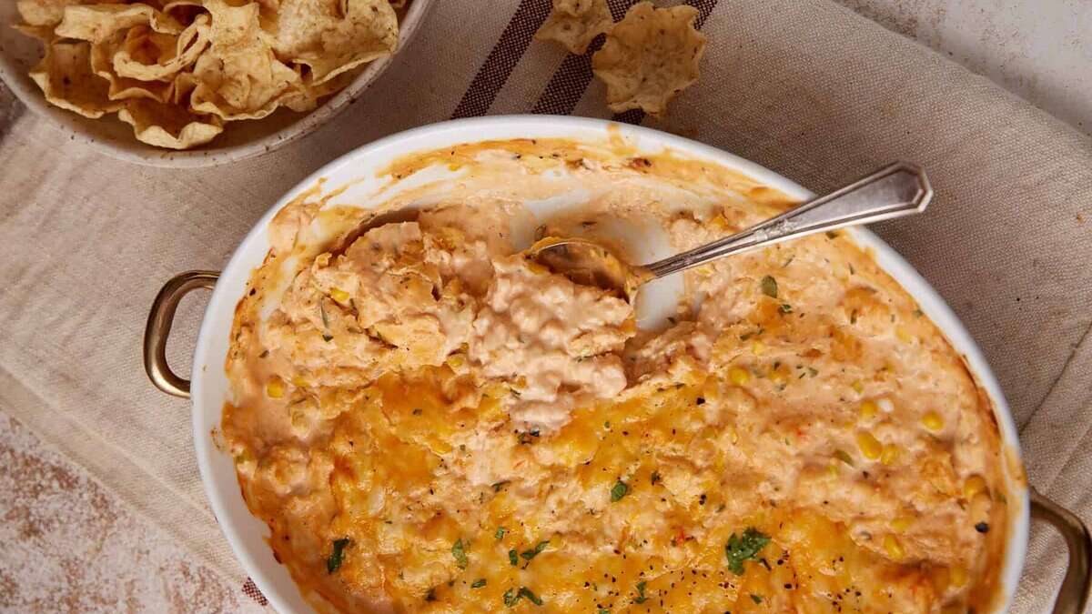Hot shrimp and crab dip in a casserole dish.