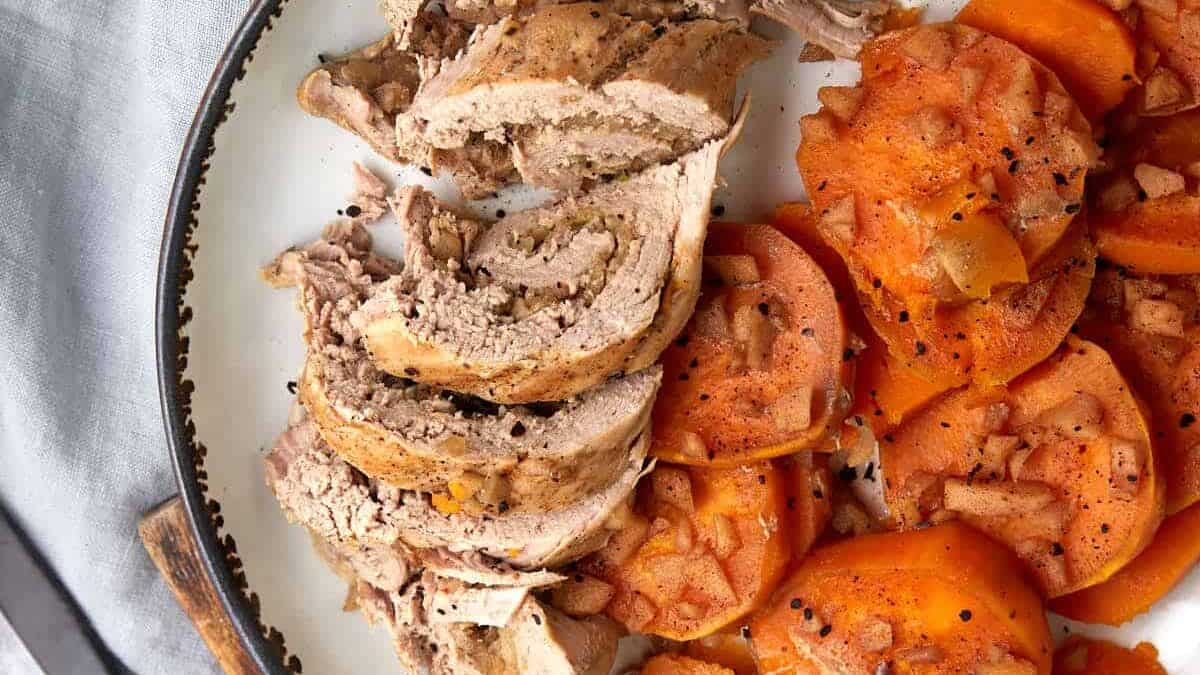 Sweet potatoes and pork on a platter.