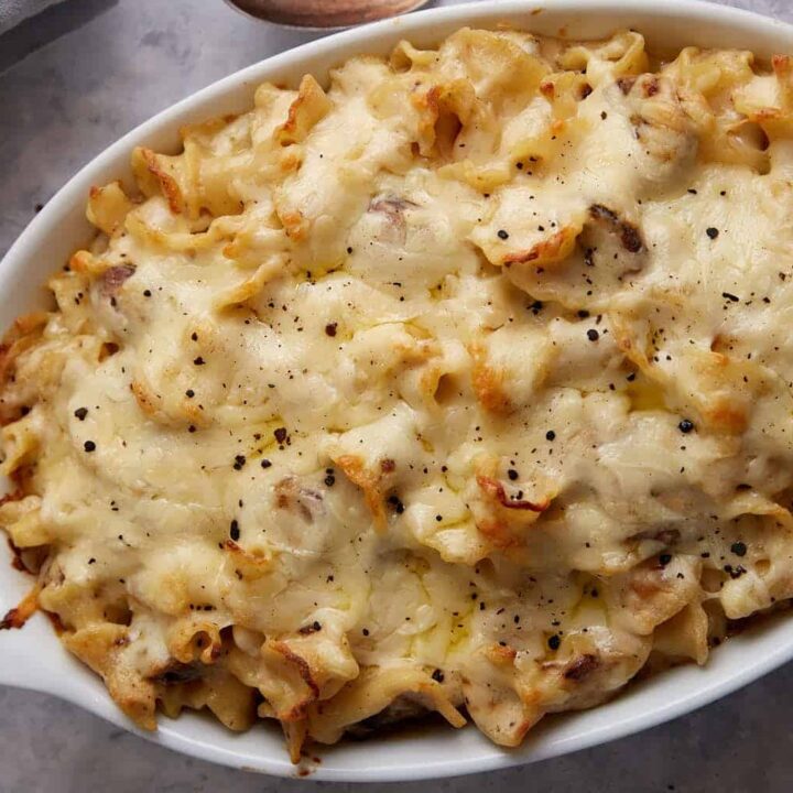 A casserole dish of baked kielbasa mac and cheese.