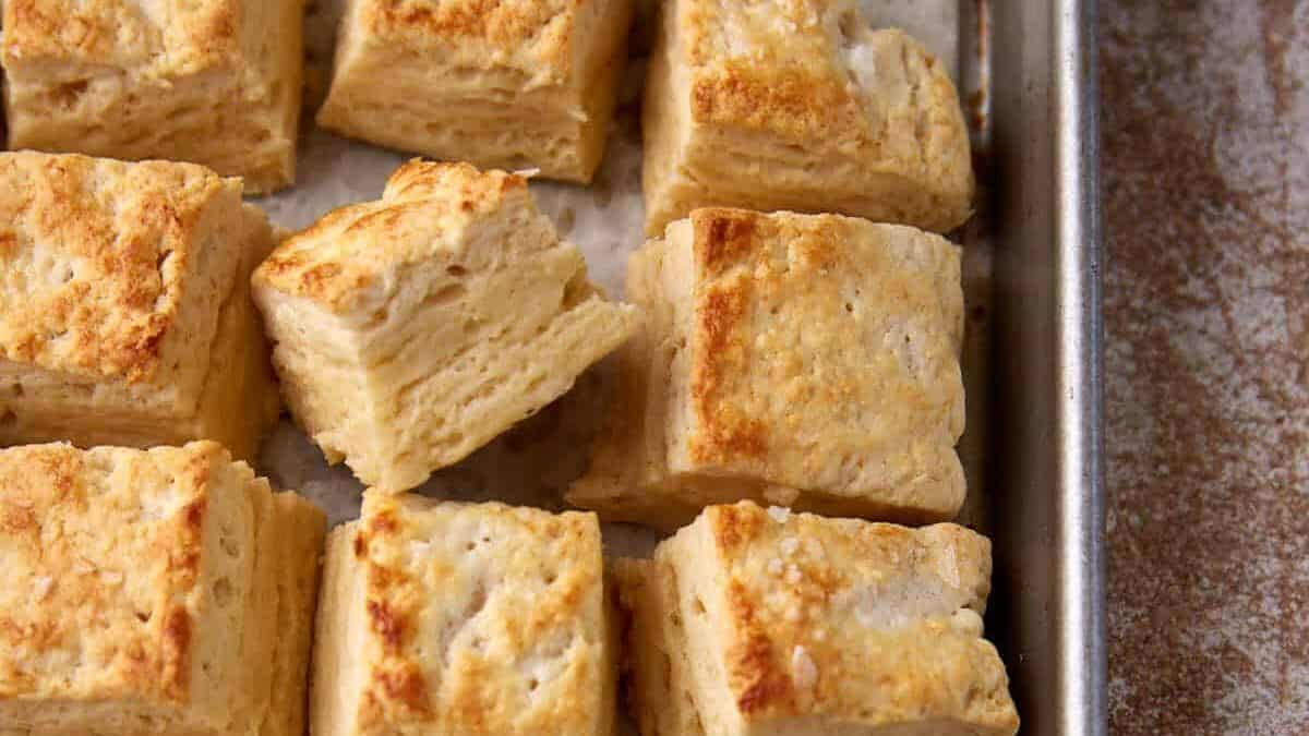 Square biscuits on a baking sheet.
