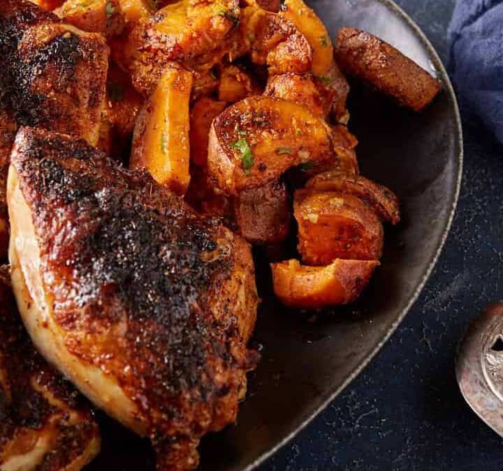 A platter of sweet potatoes and chicken.