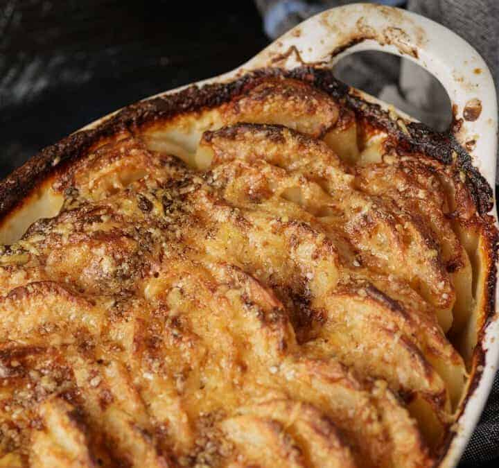 A baked dish of au gratin potatoes.