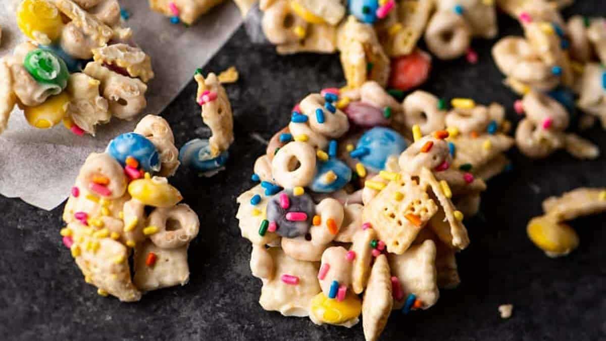 White chocolate chex mix on a cookie sheet.