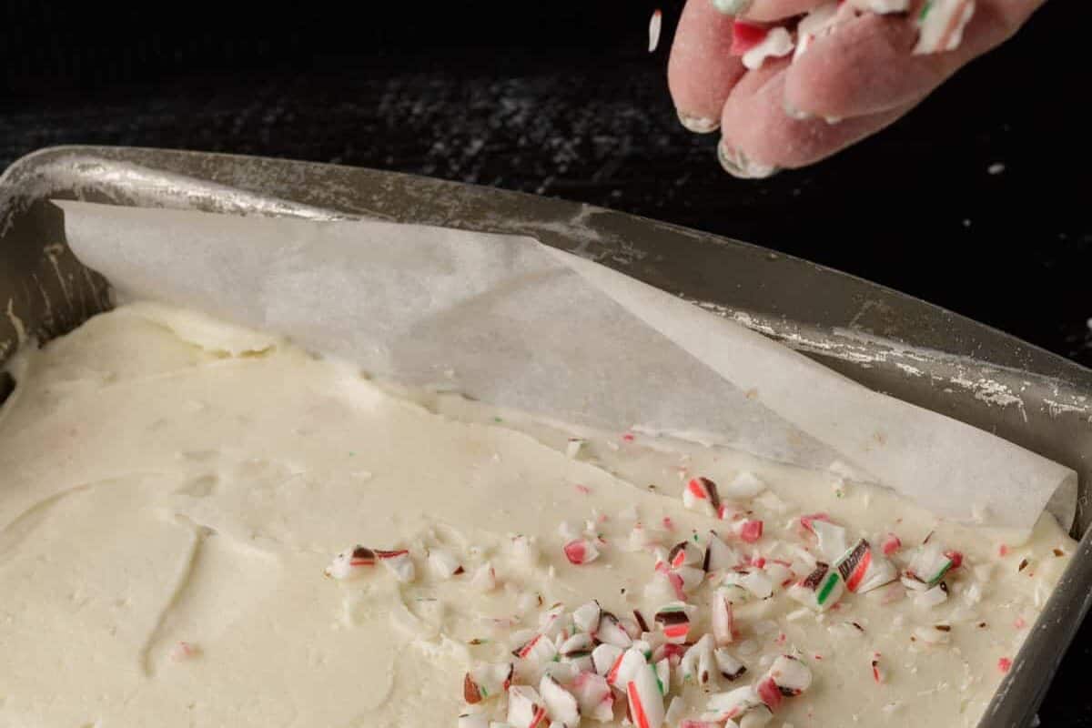 Crushed candy canes sprinkles on a pan of blondie.