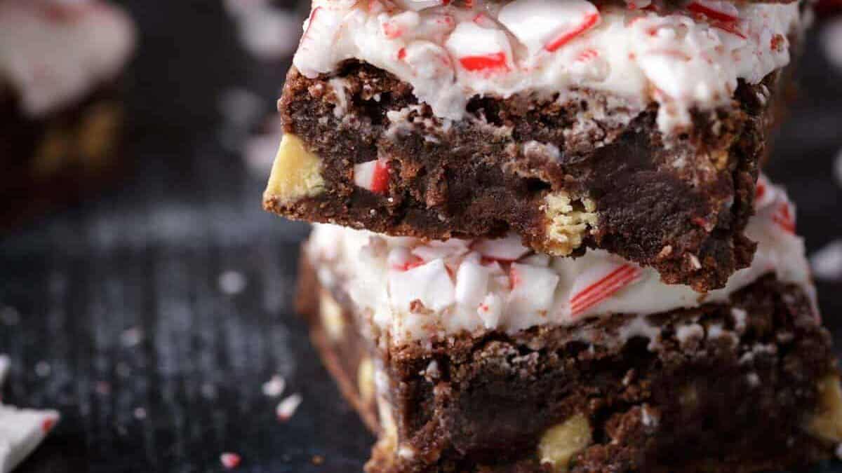 A stack of Christmas brownies with frosting.